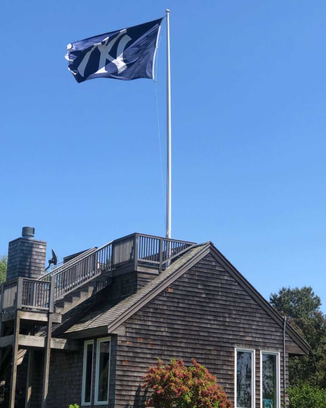 New York Giants flag flying over a house